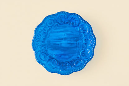 Blue decorative plate on a beige background