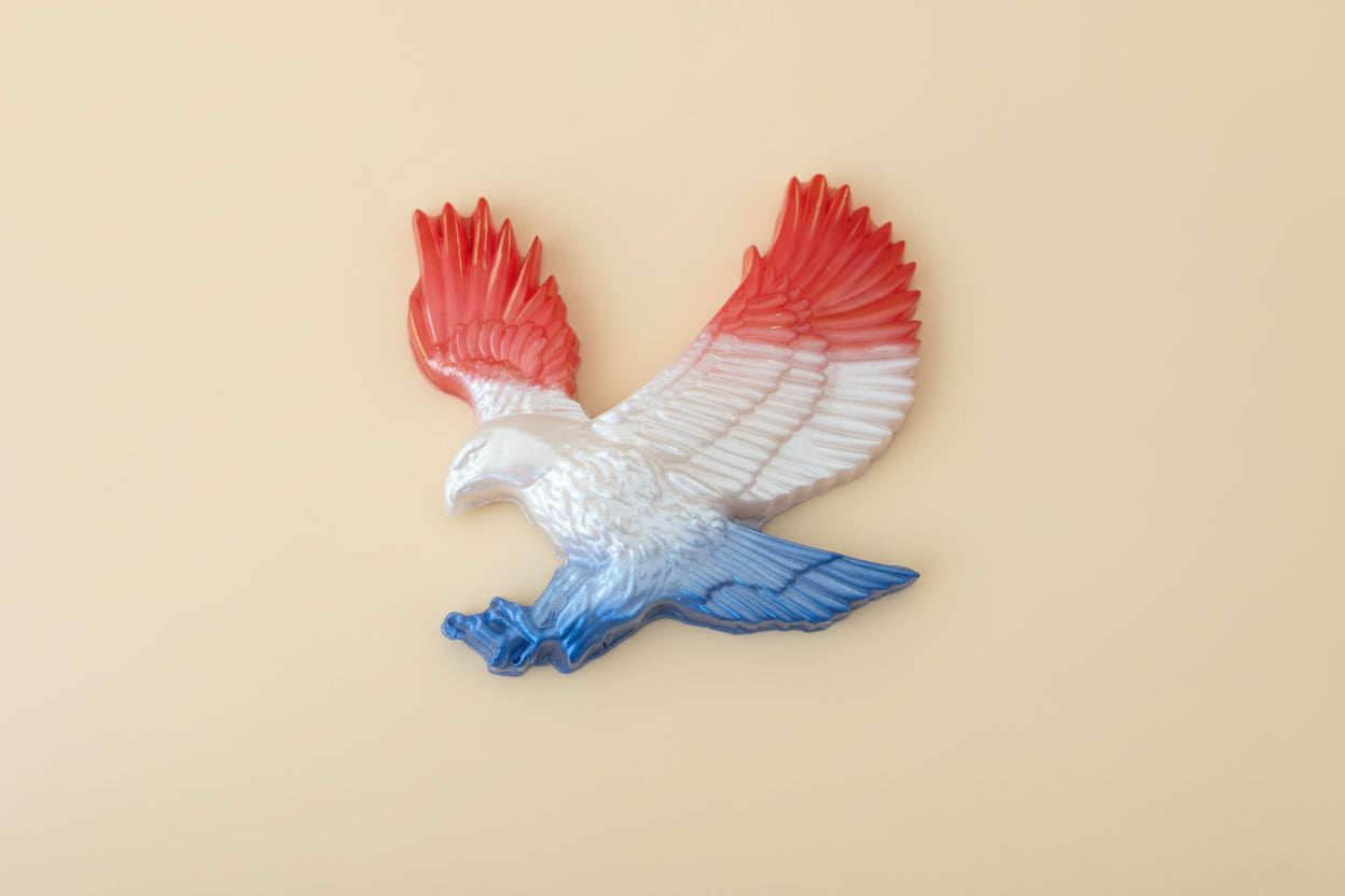 resin eagle figurine with red and blue wings 