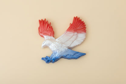 resin eagle figurine with red and blue wings 