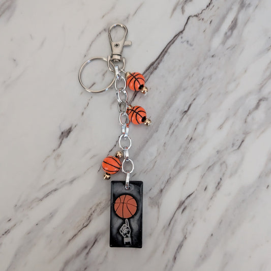 Keychain with basketball design on a marble surface