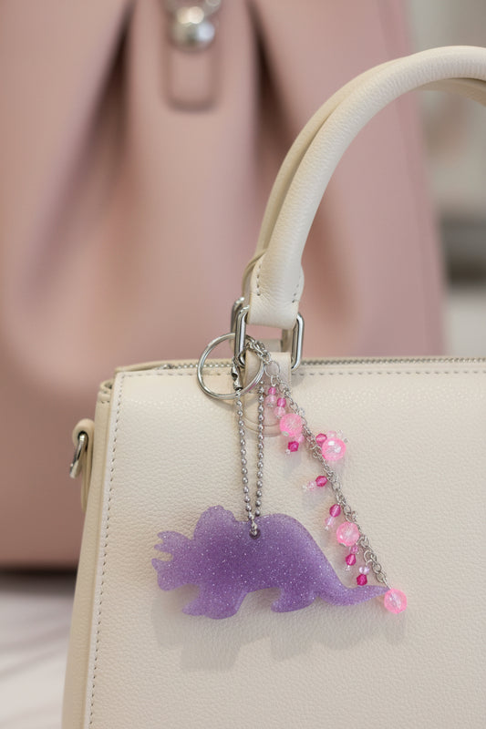 Triceratops Bag Charm – Handmade Resin Dinosaur Keychain with Beaded Tassel