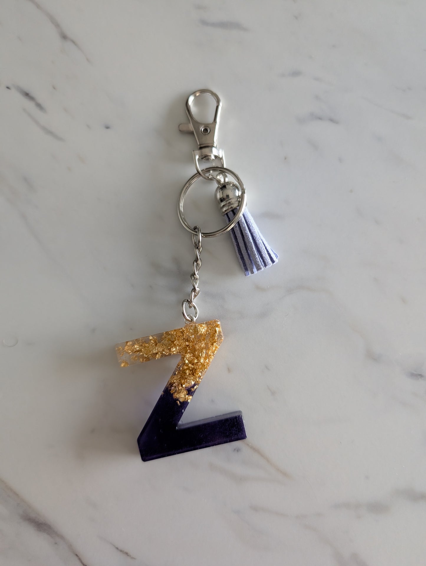Keychain with letter 'Z' charm on a marble surface