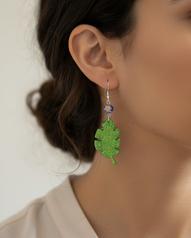 Sparkling Botanical Leaf Dangle Earrings with Blue Floral Accent
