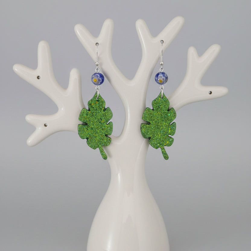 Sparkling Botanical Leaf Dangle Earrings with Blue Floral Accent