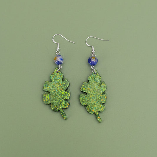 Sparkling Botanical Leaf Dangle Earrings with Blue Floral Accent