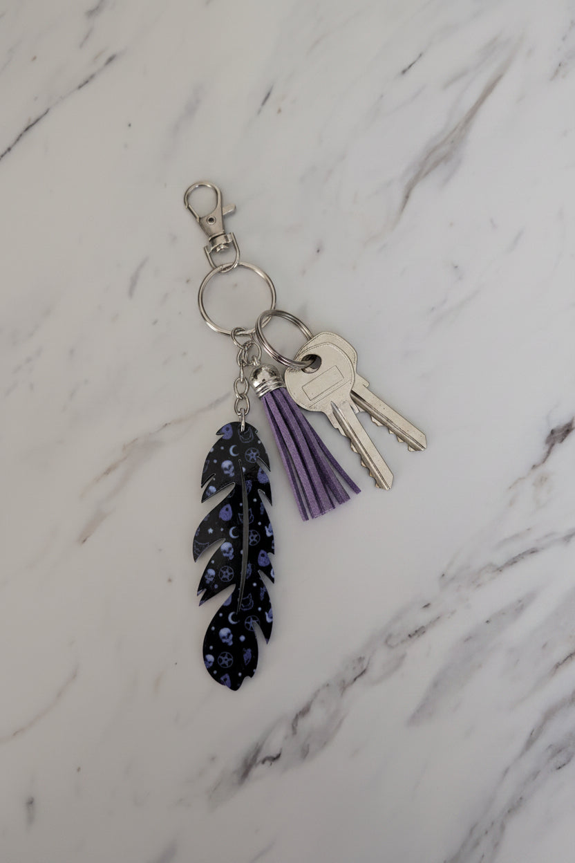 Purple Skull & Celestial Feather Keychain – Gothic Bag Charm with Fringe Tassel
