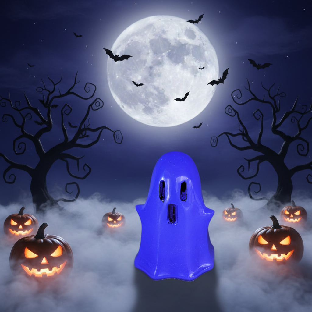 Glowing purple resin ghost trinket surrounded by lit jack-o'-lanterns, fog, and full moon background for Halloween decor inspiration.