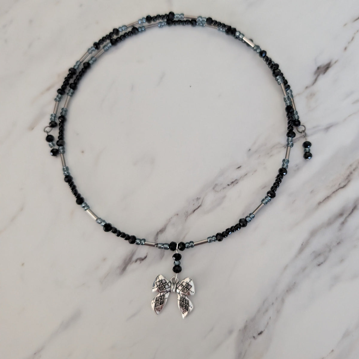 Black Crystal & Silver Tube Bead Memory Wire Choker – Textured Bow Charm