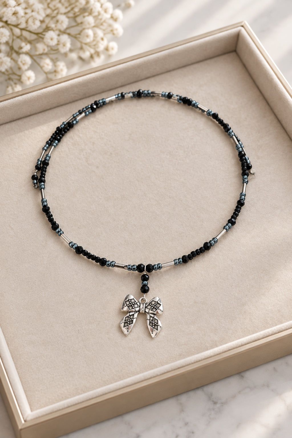 Black Crystal & Silver Tube Bead Memory Wire Choker – Textured Bow Charm