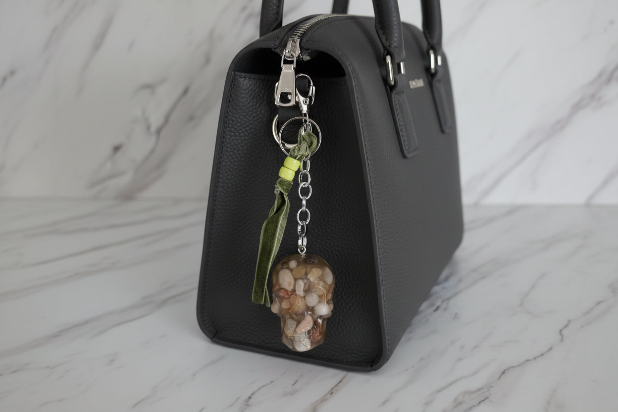 Keychain with natural stone pendant on a marble surface