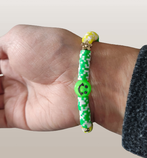 Bracelet - Medium 7.5 inches "Lucky" elastic green & yellow clay beads with gold flower spacer beads and a green happy face bead