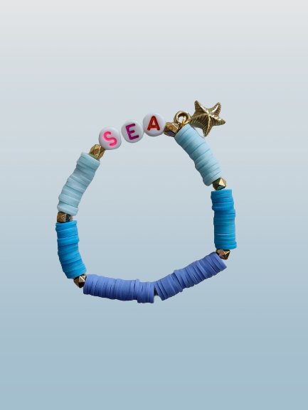 Bracelet - Elastic "Sea" with colorful clay beads and gold spacer beads and a starfish charm