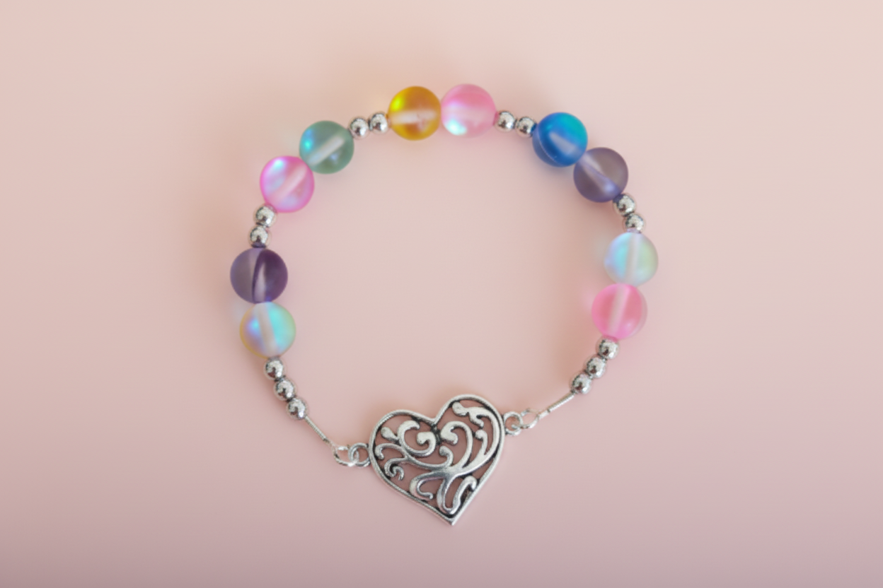A multicolored elastic bracelet with colorful glass beads and a silver heart charm.