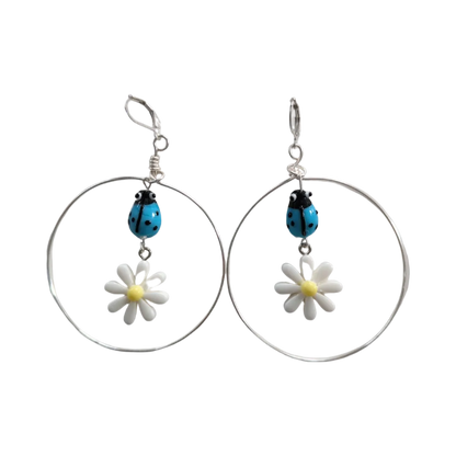 Earrings - Glass lady bug with Paris daisy flower and wire circle on lever back hoop earring