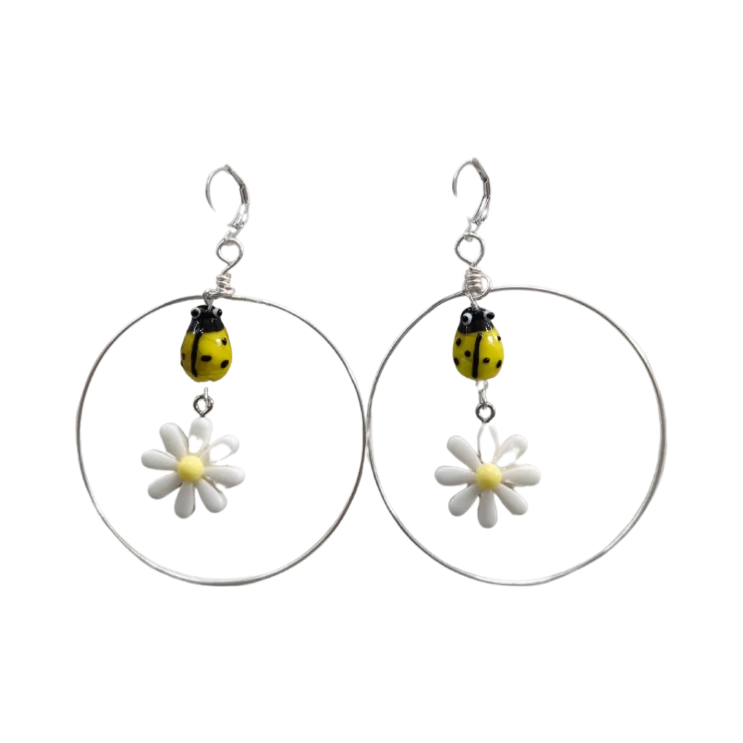 Earrings - Glass lady bug with Paris daisy flower and wire circle on lever back hoop earring