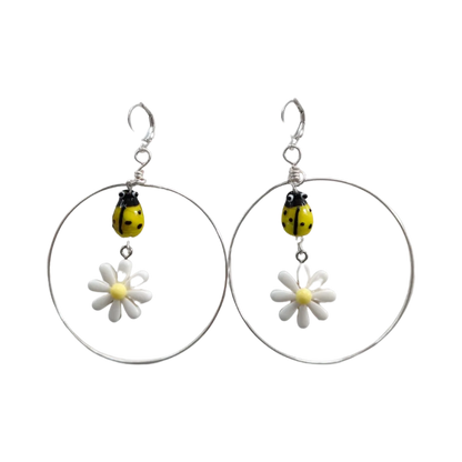 Earrings - Glass lady bug with Paris daisy flower and wire circle on lever back hoop earring