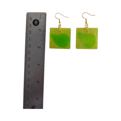 Earrings - Resin medium yellow glitter square with green leaf on gold hook