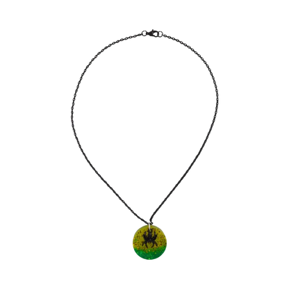 Necklace - 18 inches black chain with round yellow green resin circle ad black spider charm